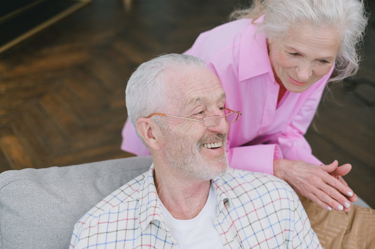 The Art of Drawing Readers In: Your attractive post title goes here Elderly couple enjoying affectionate conversation at home.